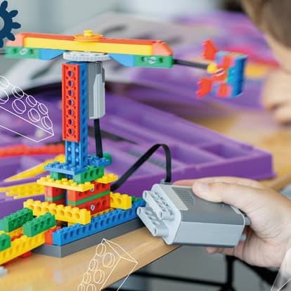 A student building a motorized model