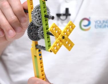 A Young Engineers student building a gear model